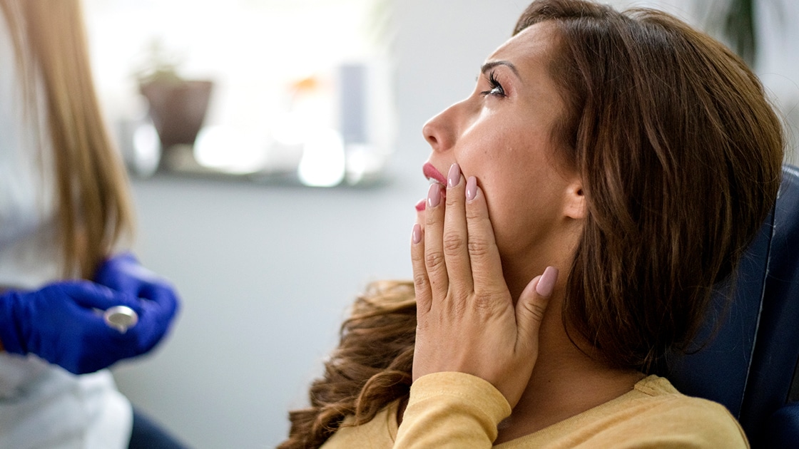 Woman Speaking with Dentist photo