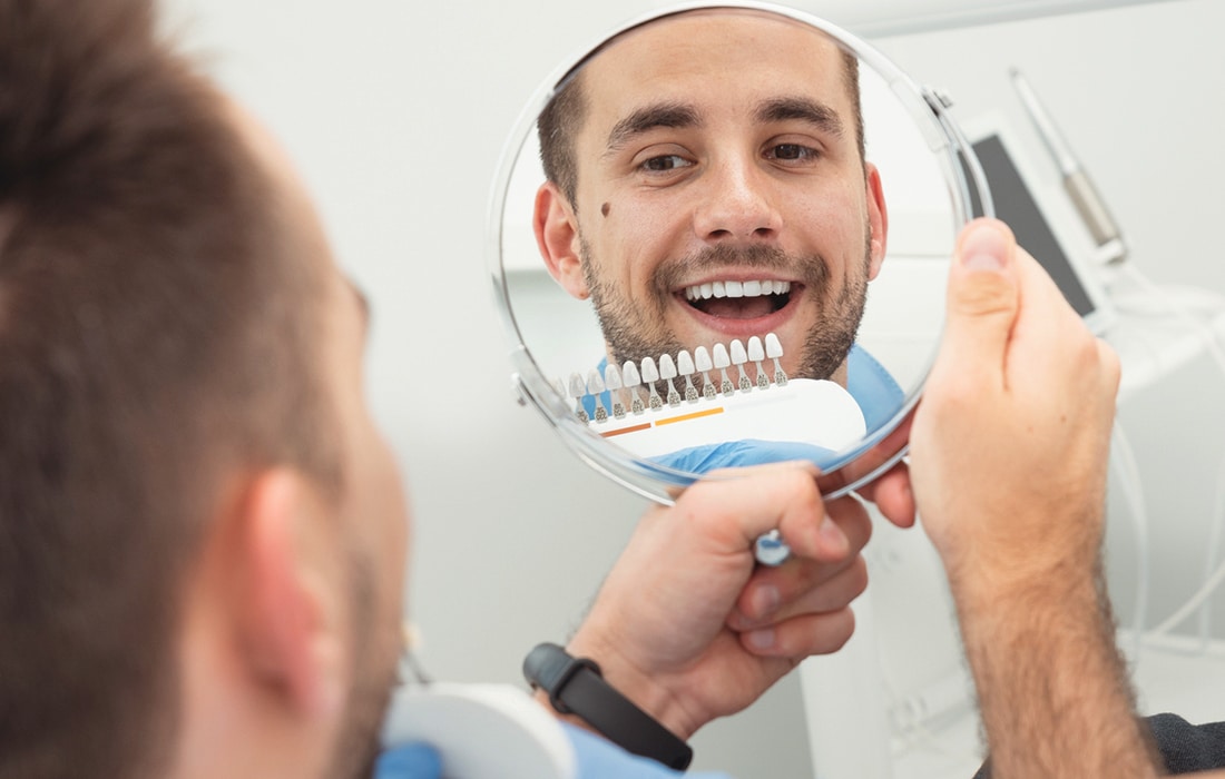 Smiling Man Looking in Mirror